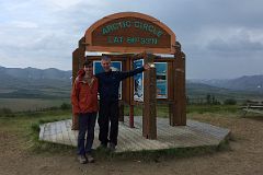 
Peter And Jerome Ryan Pose In Front Of The Arctic Circle Sign Next To Dempster Highway In Yukon On Day Trip From Inuvik
